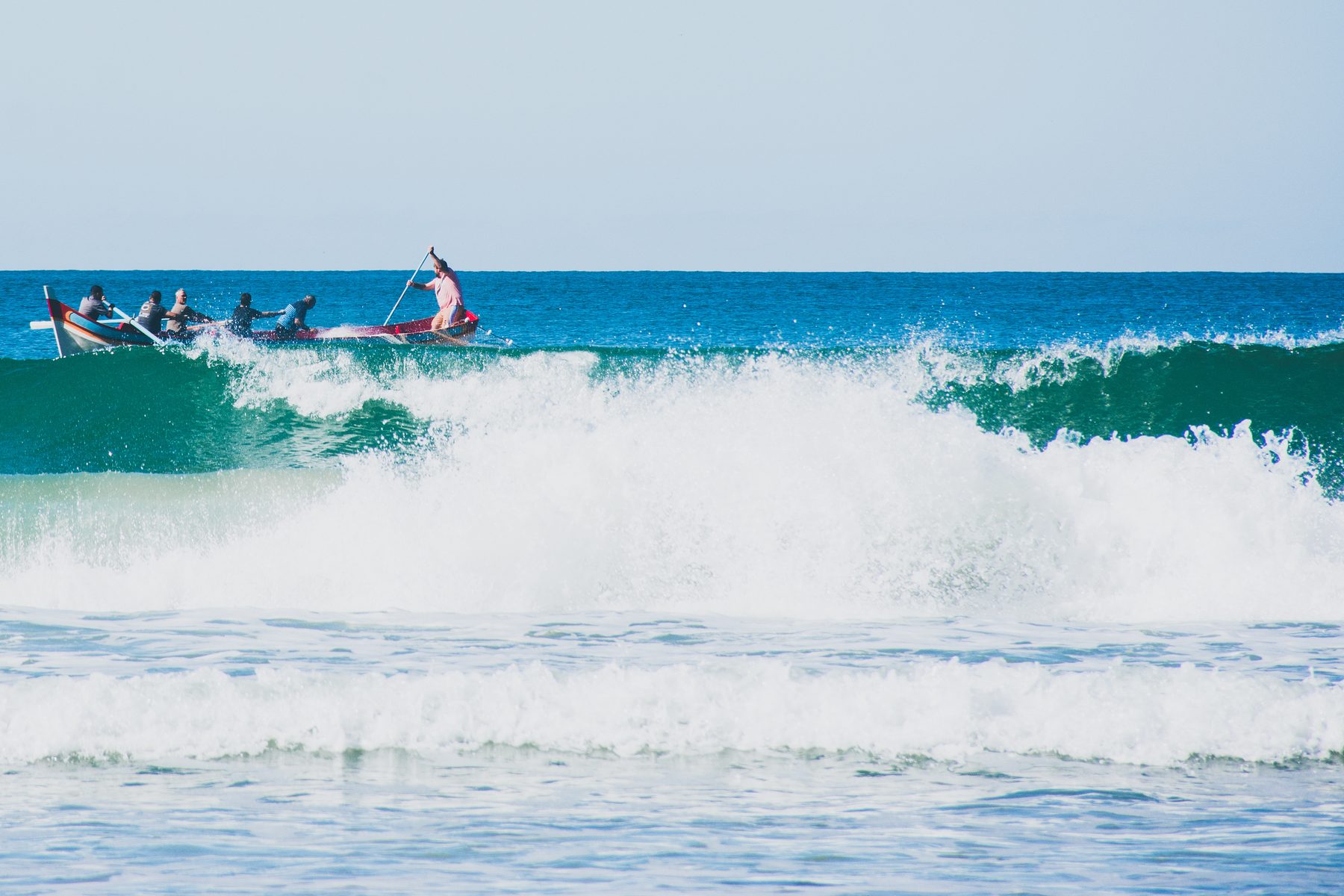 Crew standing around the boat, gesturing
